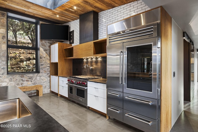 51 Rill Rd, Prescott, AZ 86305 - kitchen featuring high end appliances, open shelves, dark countertops, wood ceiling, and modern cabinets