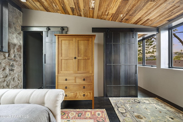 51 Rill Rd, Prescott, AZ 86305 - bedroom with lofted ceiling, wooden ceiling, and dark wood-type flooring
