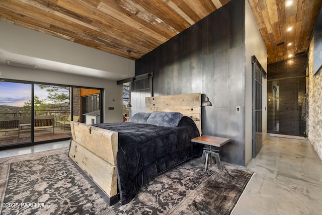 51 Rill Rd, Prescott, AZ 86305 - bedroom featuring wood ceiling, high vaulted ceiling, access to exterior, concrete floors, and a barn door