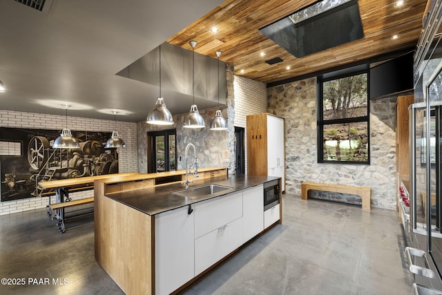 51 Rill Rd, Prescott, AZ 86305 - kitchen with a sink, modern cabinets, concrete flooring, a center island with sink, and wood ceiling