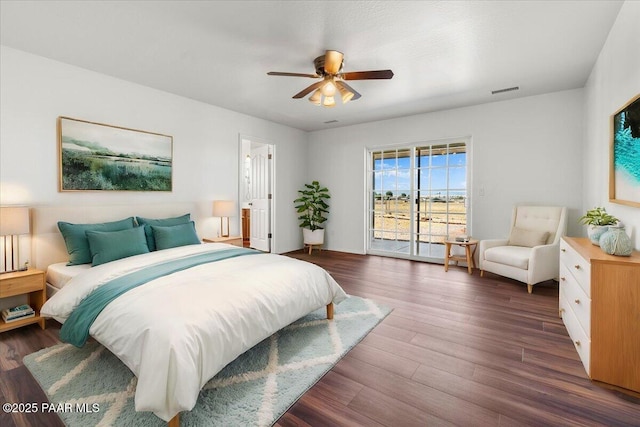 bedroom with dark wood finished floors, ceiling fan, and access to outside