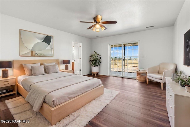 bedroom featuring ceiling fan, wood finished floors, and access to exterior