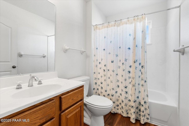 bathroom featuring shower / tub combo, wood finished floors, vanity, and toilet