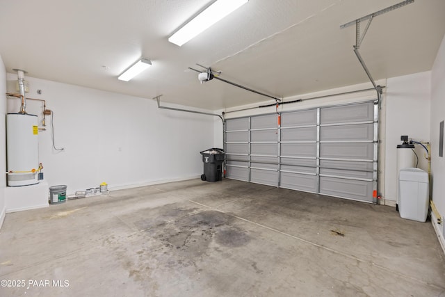 1735 Oro Dr, Cottonwood, AZ 86326 - garage featuring gas water heater, a garage door opener, baseboards, and electric panel