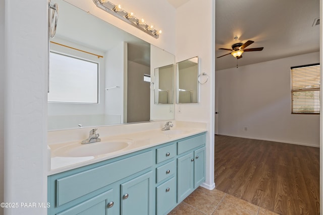 1735 Oro Dr, Cottonwood, AZ 86326 - full bath with double vanity, ceiling fan, and wood finished floors