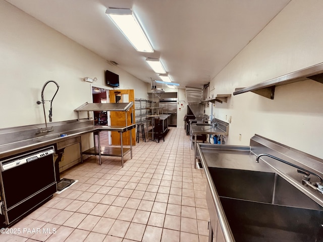 28555 N Feather Mountain Rd, Paulden, AZ 86334 - kitchen with stainless steel counters, dishwashing machine, a sink, light tile patterned floors, and open shelves