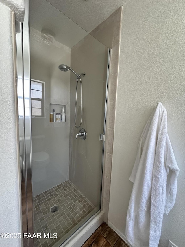 6217 N Little Papoose Dr, Prescott Valley, AZ 86314 - bathroom with a shower stall and wood finished floors