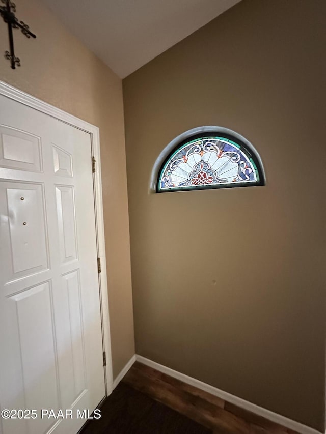 6217 N Little Papoose Dr, Prescott Valley, AZ 86314 - unfurnished bedroom featuring dark wood-style floors and baseboards