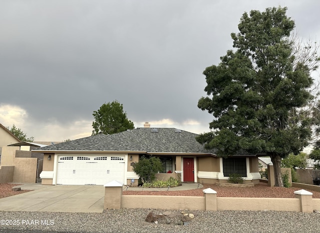 6217 N Little Papoose Dr, Prescott Valley, AZ 86314 - ranch-style house with an attached garage, concrete driveway, a shingled roof, and stucco siding