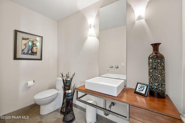 13175 N Bull Run Rd, Prescott, AZ 86305 - half bath with a sink, toilet, baseboards, and tile patterned floors