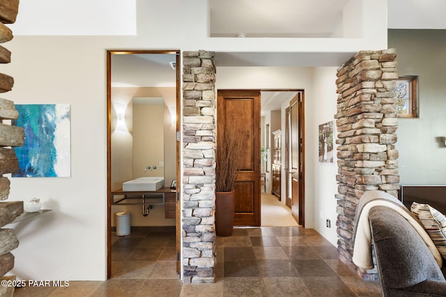 13175 N Bull Run Rd, Prescott, AZ 86305 - corridor featuring decorative columns and a sink