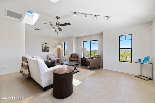 13175 N Bull Run Rd, Prescott, AZ 86305 - living area featuring rail lighting, ceiling fan, and a skylight
