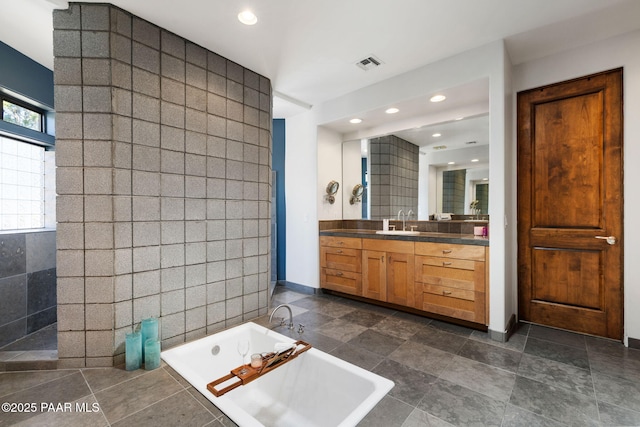 13175 N Bull Run Rd, Prescott, AZ 86305 - full bath featuring tiled tub, vanity, tile walls, recessed lighting, and baseboards