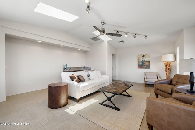 13175 N Bull Run Rd, Prescott, AZ 86305 - living room with track lighting, vaulted ceiling, a skylight, and a ceiling fan
