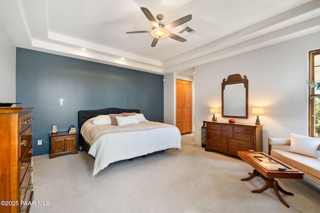 13175 N Bull Run Rd, Prescott, AZ 86305 - bedroom with light carpet, a raised ceiling, and a ceiling fan