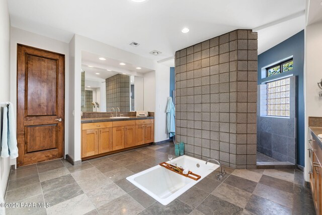 13175 N Bull Run Rd, Prescott, AZ 86305 - bathroom with vanity, tile walls, a bath, walk in shower, and recessed lighting