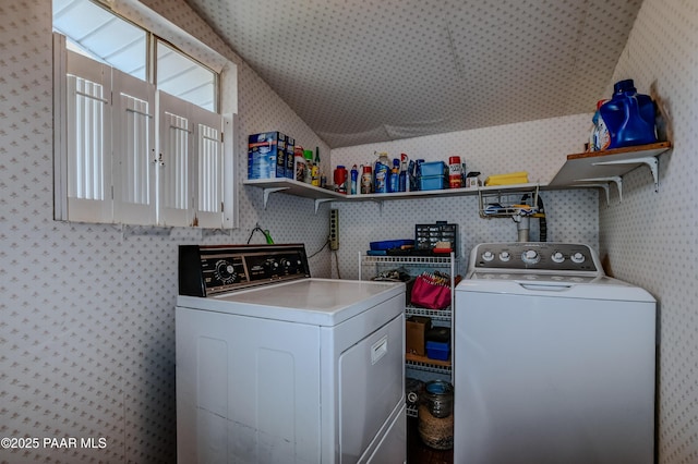 washroom featuring wallpapered walls, laundry area, and washing machine and dryer