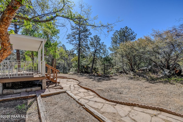 view of yard featuring a wooden deck