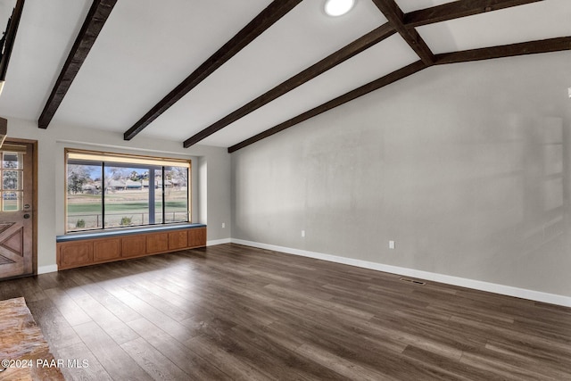 unfurnished living room featuring vaulted ceiling with beams and dark hardwood / wood-style floors