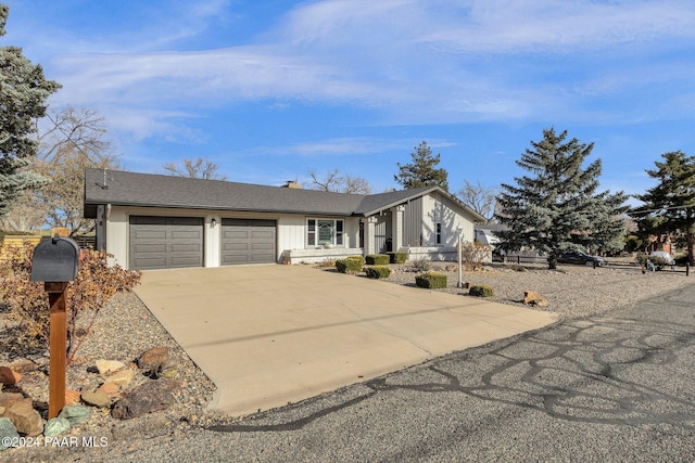 ranch-style house featuring a garage