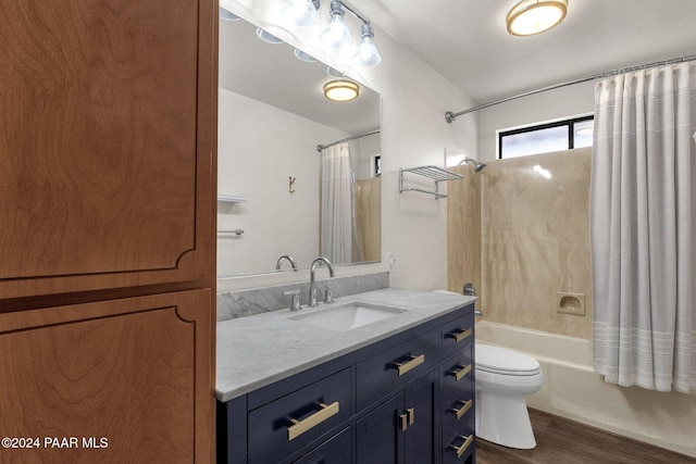 full bathroom with shower / tub combo, vanity, wood-type flooring, and toilet