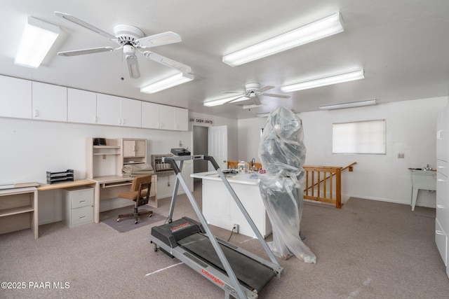 exercise room with light carpet and ceiling fan