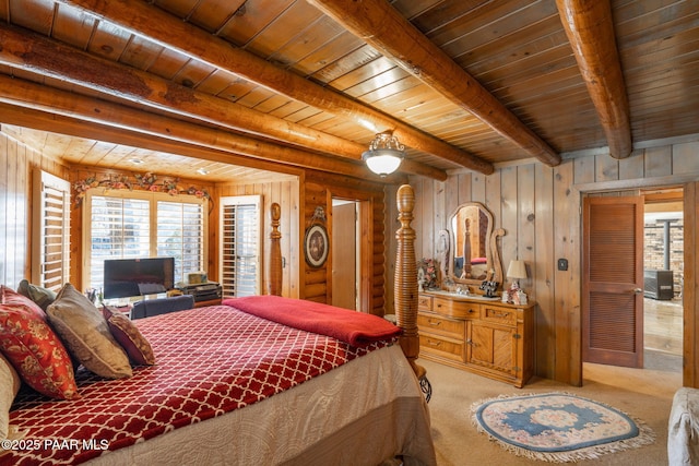 carpeted bedroom featuring beam ceiling, wood ceiling, and wooden walls