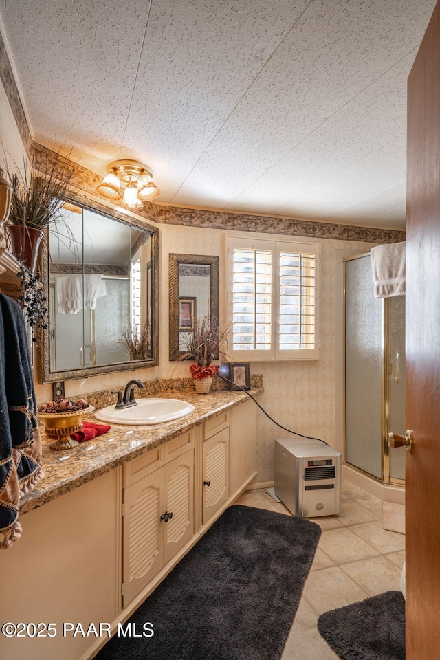 bathroom featuring vanity, tile patterned floors, and a shower with door