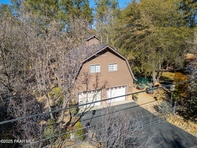 view of side of property featuring a garage