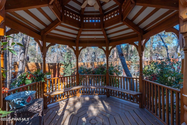 wooden deck featuring ceiling fan and a gazebo