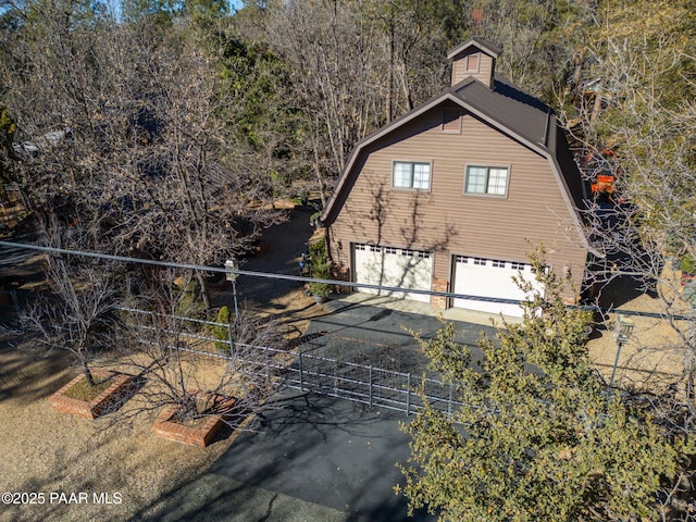 view of side of home with a garage