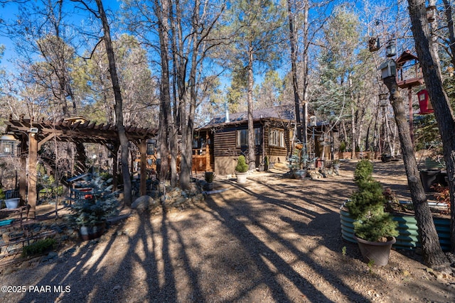 view of front of house with a pergola