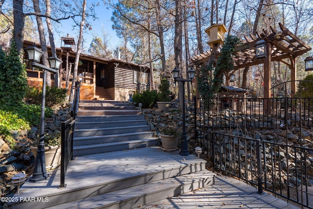 view of front of house with a pergola and a deck