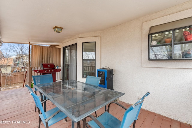 deck with outdoor dining space