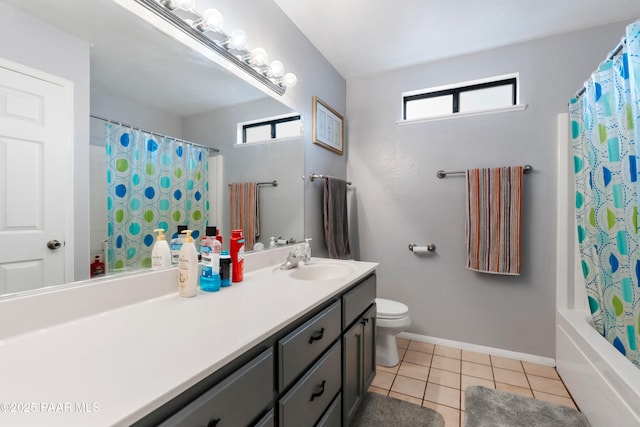 bathroom with toilet, shower / tub combo, vanity, baseboards, and tile patterned floors