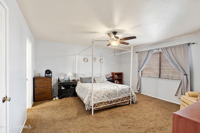 bedroom featuring carpet, ceiling fan, and a textured ceiling