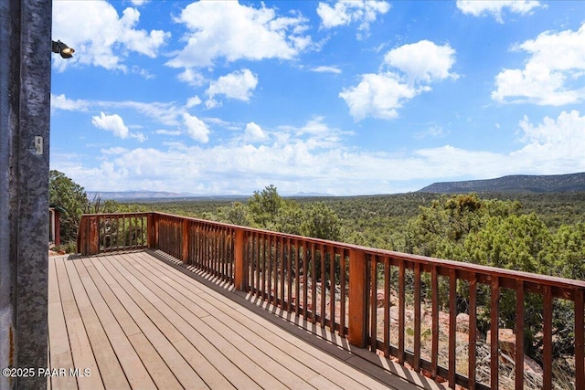 wooden terrace featuring a mountain view