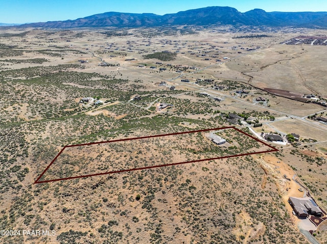 drone / aerial view featuring a mountain view