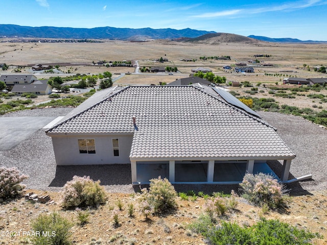 birds eye view of property with a mountain view