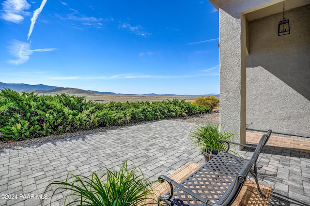 view of patio / terrace featuring a mountain view