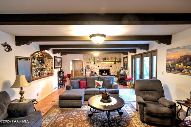 living room with hardwood / wood-style floors and beam ceiling