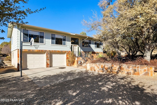 split foyer home featuring a garage