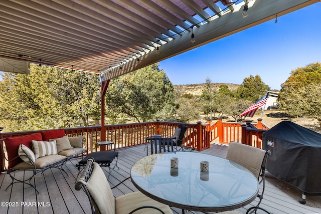 wooden terrace featuring an outdoor hangout area, a pergola, and grilling area