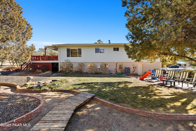 back of property featuring a patio, a deck, a yard, and central AC unit