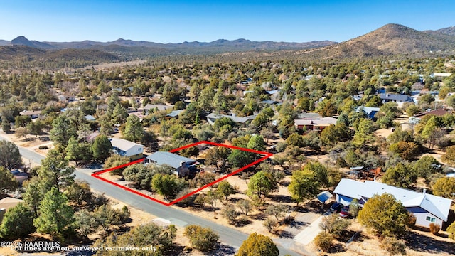 birds eye view of property featuring a mountain view