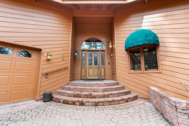 entrance to property featuring a garage