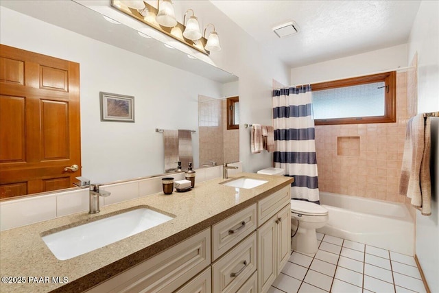 bathroom with tile patterned flooring, double vanity, toilet, and a sink