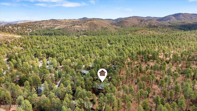 bird's eye view with a forest view and a mountain view