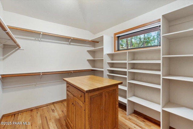 spacious closet featuring light wood-style flooring