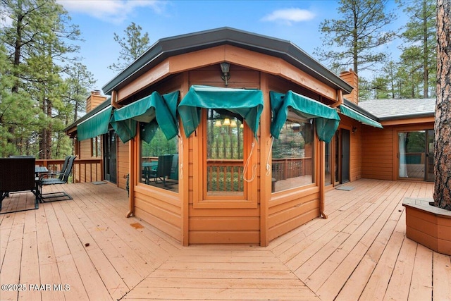 wooden terrace with outdoor dining space